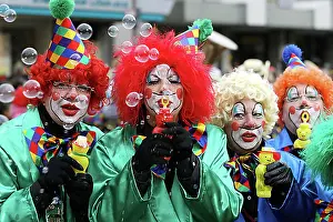 Traditional Attire Prints: Mardi gras parade in Koblenz, Rhineland-Palatinate, Germany: clowns making soap-bubbles