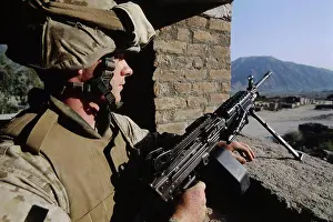 Brick Prints: US Marine Infantryman Guards a Forward Operating Base in Asadabad