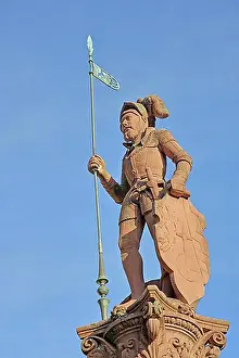 Middle Ages Prints: Market fountain with medieval sculpture Landsknecht