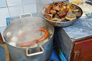 Seafood Prints: Market scene with a traditional curanto in the market hall in Angelmo