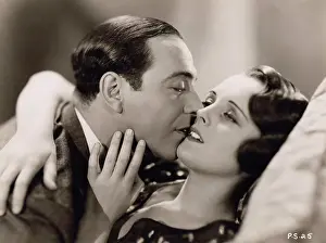 Kissing Prints: Mary Astor and Ricardo Cortez in a scene from Radio Pictures 'Behind Office Doors'
