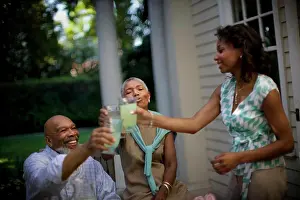 Bald Prints: Mature couple sharing a toast with their daughter