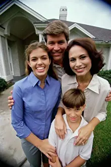 Sseditor Aa Prints: Mature couple with their son and daughter smiling