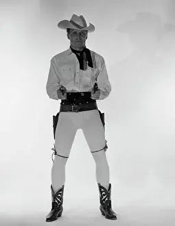 Arms Up Prints: Mature cowboy holding guns