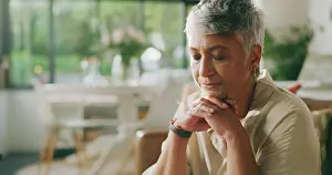 Healing Prints: Mature woman, prayer and faith on sofa in home for gratitude