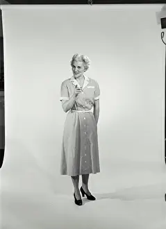 Pointing Prints: Mature woman standing and pointing forward