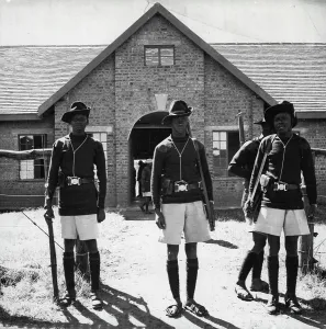 Guard Prints: Mau Mau Trials In KenyaGuard outside the court at Kapenguria where Jomo Kenyatta is being tried on a charge of managing