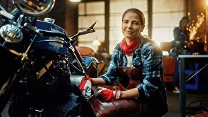 Motor Prints: Mechanic working on a motorcycle