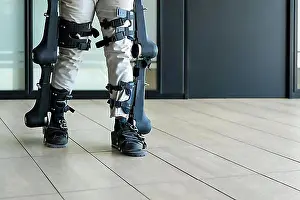 Disability Prints: Mechanical exoskeleton, unrecognizable disabled person walking with the help of robotic skeleton