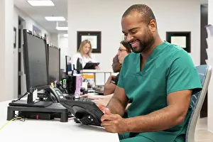 Computers Prints: Medical professional using technology for efficient patient care in a modern clinic