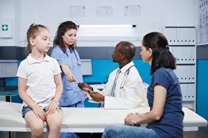 Examination Prints: Medical staff advising female patients