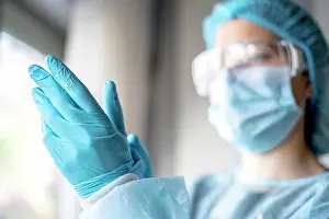 Prevention Prints: Medicine and Surgery theme: doctor putting on protective blue gloves