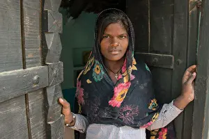 W All Prints: Meena woman standing in doorwaybhooriphari Ranjasthan India