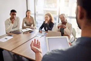 Coach Prints: Meeting, presentation and a business man with a tablet in the boardroom