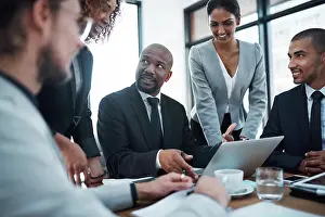 Meet Prints: Meeting, talking and business people with laptop in office for planning