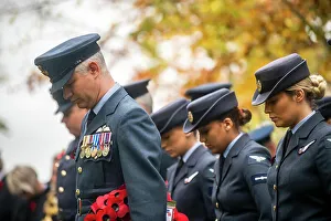 Air Force Prints: Members of the Royal Air Force bow their heads during a Remembrance Day ceremony at RAF Welford