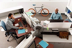 Associate Prints: Men working at computers in office