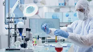 Examination Prints: Microbiologist scientist researcher mixing medical solution developing vaccine