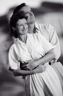 Pregnancy Prints: Mid adult couple embracing each other