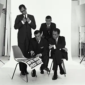 Meet Prints: Four mid adult men talking