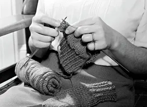 Skilled Prints: Mid section of woman knitting