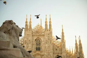 Lombardy Prints: Milan Cathedral and Lion Statue with Sunlight in Lombardy, Italy