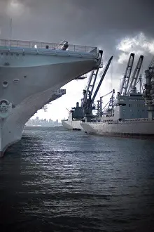Seas Prints: Military ship resting in a commercial dock