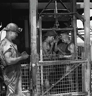 Hardhat Prints: Miners in cage at Noble's Nob mine are ready to be lowered to work at the bottom level