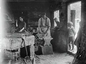 Ministry of Information First World War Official Collection Woman helping her blacksmith husband in his forge