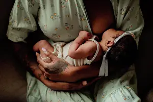 Tattoo Prints: Mixed baby nursing on her black mother