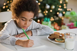 Biscuit Prints: Mixed Race boy writing letter to Santa Claus