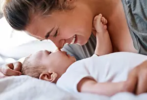 Maternity Prints: Mom, baby and happy on bed in home for support