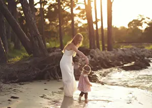 Florida Prints: Mom and Girl Dancing in Golden hour by Water
