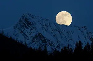 Rising Prints: Full moon over the Canadian Rockies near Canal Flats, British Columbia