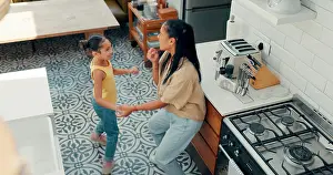 Singing Prints: Mother, child and happy dance in kitchen with energy