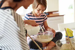 Bake Prints: Mother, cooking or kid baking in kitchen as a family with a young kid learning cookies recipe at home
