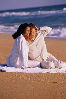 Picnic Prints: Mother and daughter sitting on the beach