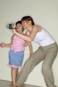 Video Prints: Mother and daughter using video camera