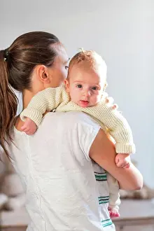 Cuddle Prints: Mother holding her 3 month old baby boy