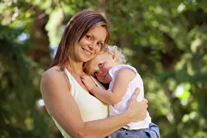 Secure Prints: mother holding toddler in a park, edmonton alberta canada