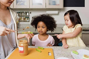 Orient Prints: A mother making food for children