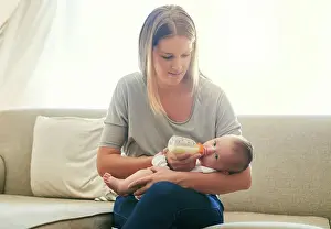 Feed Prints: Mother, milk and feeding baby of sofa in living room for growth development