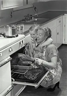 Short Prints: Mother preparing turkey with her son
