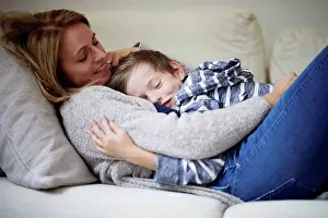 Secure Prints: Mother and son cuddling on the couch
