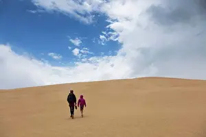 The Way Forward Prints: Mother and son walking along remote sand dunes, Wilsons Promontory, Victoria, Australia