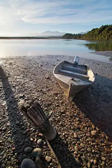 Island Prints: Motor boat at sunrise, Okarito Lagoon, West Coast, South Island, New Zealand, Pacific