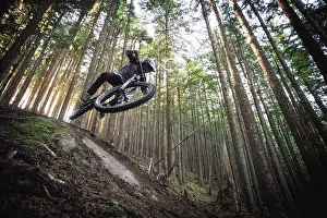 Biking Prints: Mountain biker jumps down trails in north bend Washington