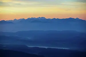 Mountain Chain Prints: Mountain silhouette, mountains at dawn with a view of the Klagenfurt basin with Lake Lake Woerth and Karawanken