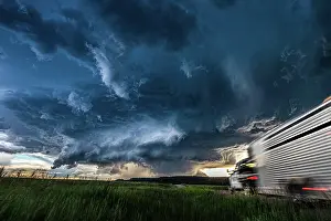 Truck Prints: Moving truck heading toward a huge storm and cloud sky