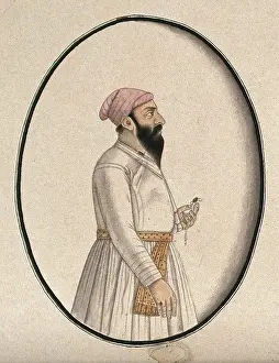 Turban Prints: A Mughal courtier wearing a pink turban and holding an ornament ()